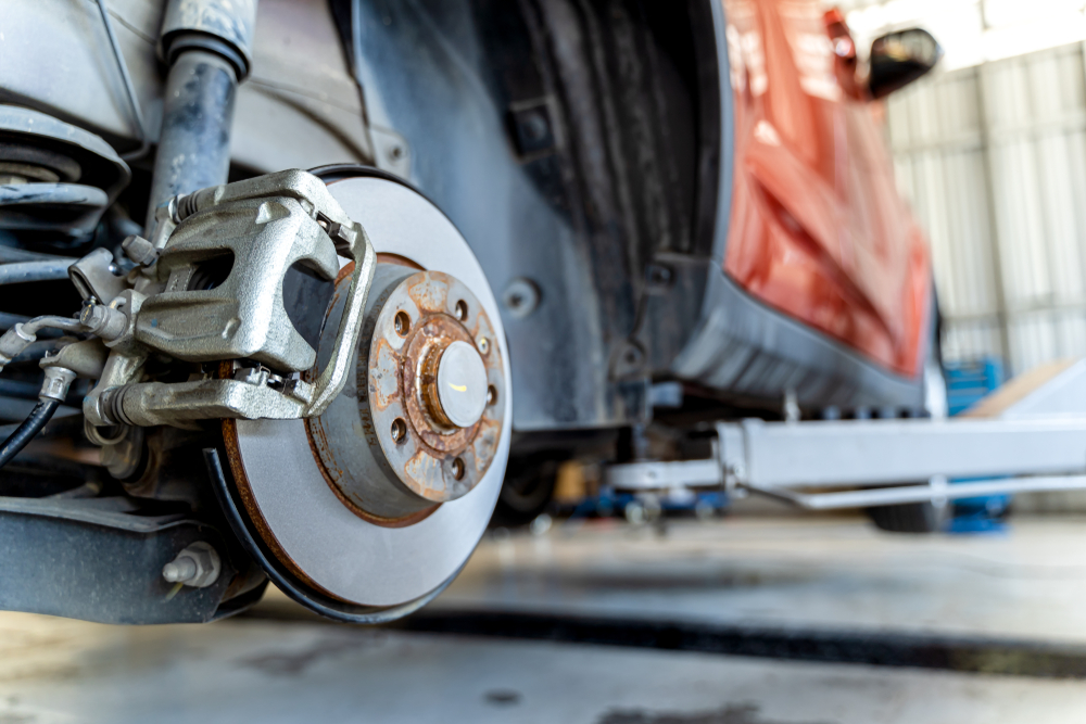 Replacing worn brake pads.